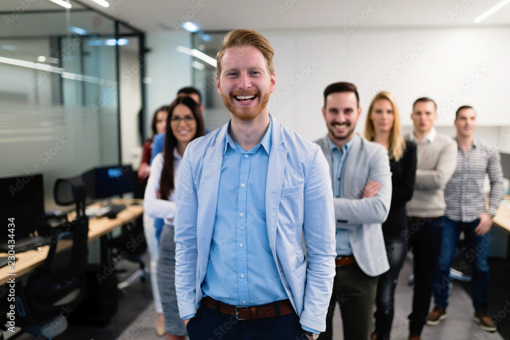 Fototapeta premium Successful team of young perspective businesspeople in office