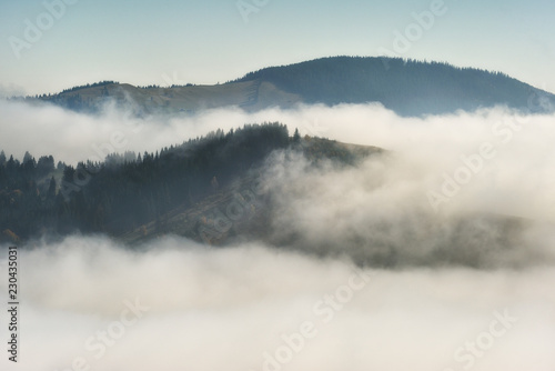 autumn sunrise in the Carpathian mountains. picturesque foggy morning