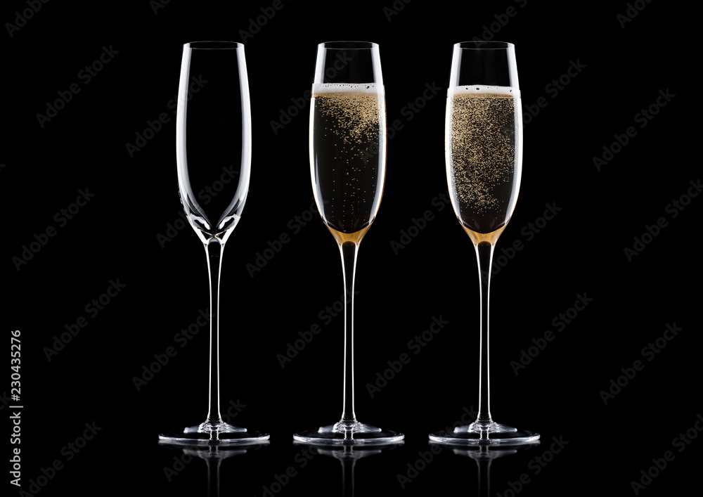 Elegant glasses of yellow champagne with bubbles Elegant glasses of yellow champagne with bubbles