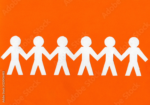Obraz na płótnie white paper men on a bright orange background. w salonie