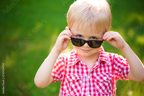 funny little boy in sunglasses. Child boy in sunglasses