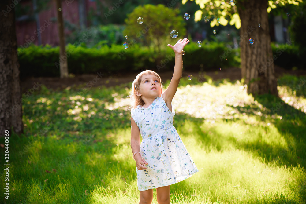 Girl with bubbles at a sunny summer evening Girl with bubbles at a sunny summer evening