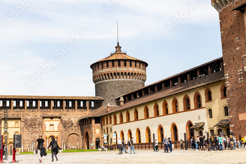 Traveler in Sforza Castle (Castello Sforzesco) is a castle in Milan, Italy photo