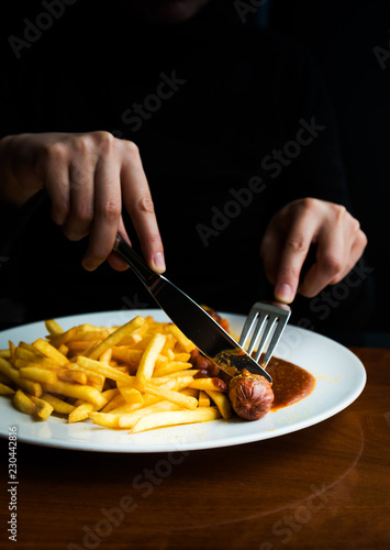 Tasty german sausage served with sauce