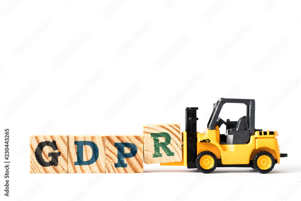 Toy forklift hold letter block r to complete word GDPR (General Data Protection Regulation) on white background Toy forklift hold letter block r to complete word GDPR (General Data Protection Regulation) on white background