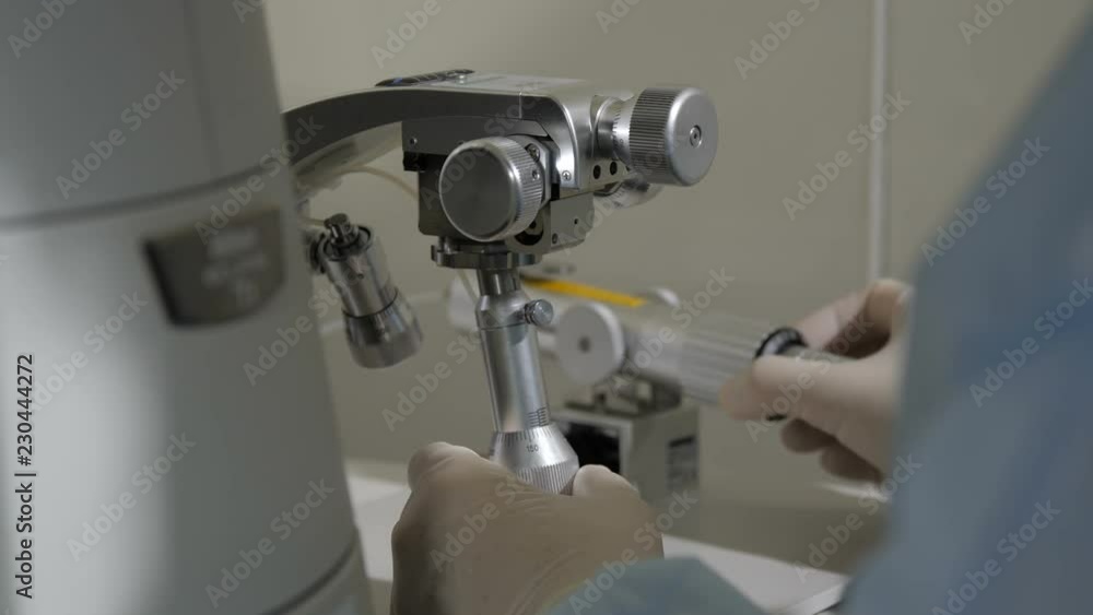 The hands of the doctor control the levers of needles The hands of the doctor control the levers of needles