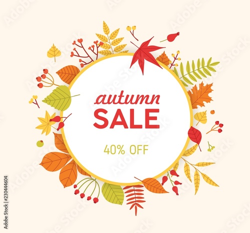 Circular autumn composition, frame or wreath made of fallen tree leaves and berries isolated on light background