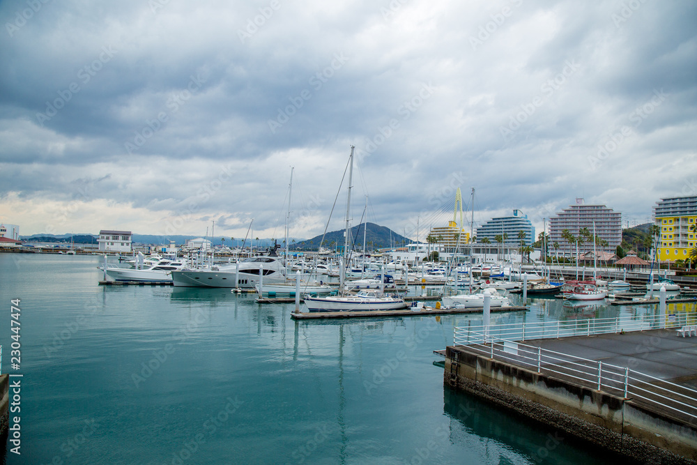 Yacht club after rain with mirror water reflect at Wakayama marina city, Kansai, Japan