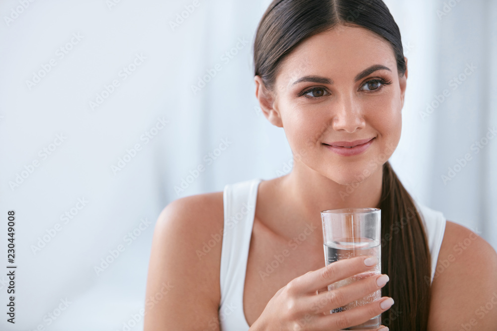 Happy Woman Drinking Water. Beautiful Female With Glass Of Water Happy Woman Drinking Water. Beautiful Female With Glass Of Water