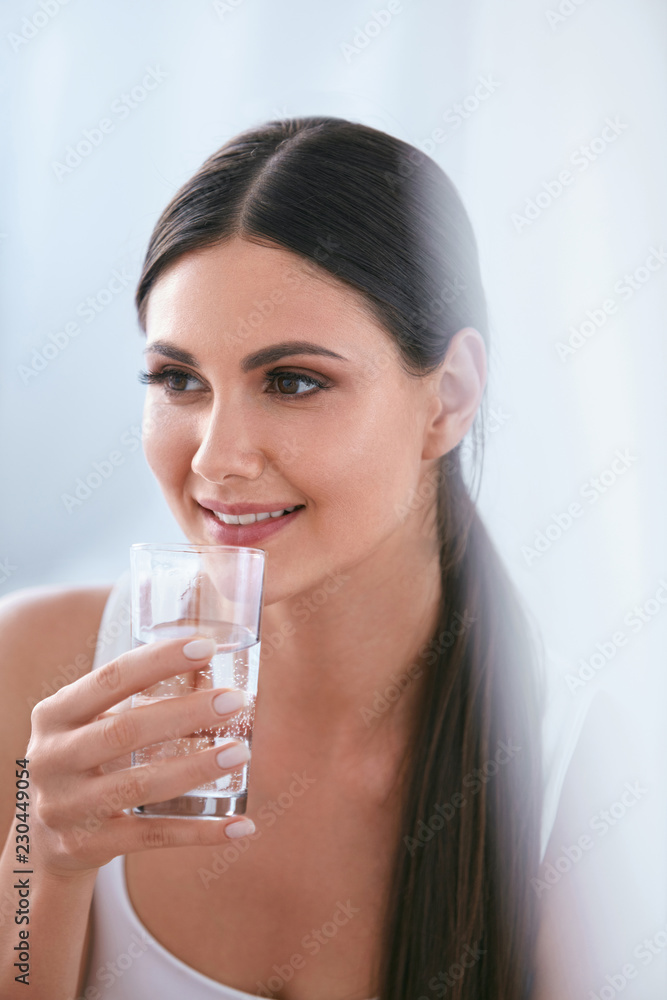 Happy Woman Drinking Water. Beautiful Female With Glass Of Water Happy Woman Drinking Water. Beautiful Female With Glass Of Water