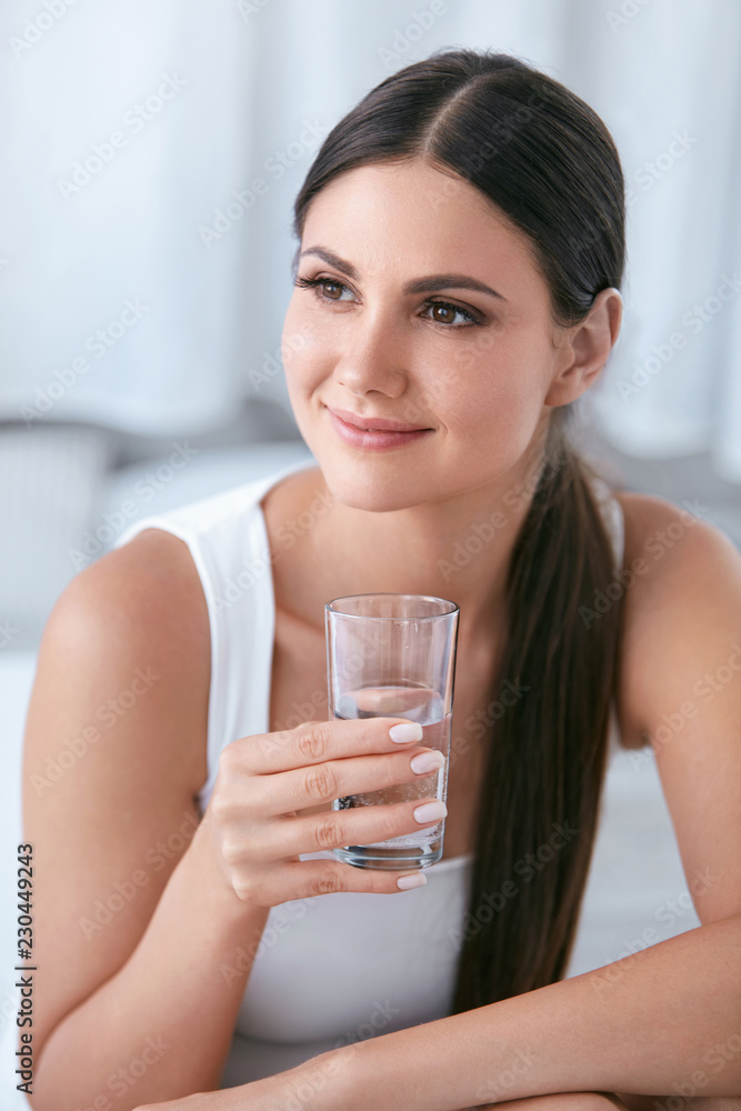Happy Woman Drinking Water. Beautiful Female With Glass Of Water Happy Woman Drinking Water. Beautiful Female With Glass Of Water