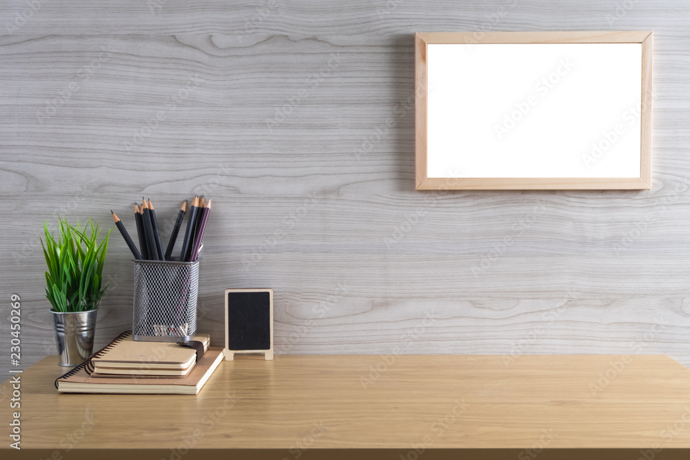 Mock up poster or photo frame and supplies on table hipster minimalism loft desk space, copy space Mock up poster or photo frame and supplies on table hipster minimalism loft desk space, copy space