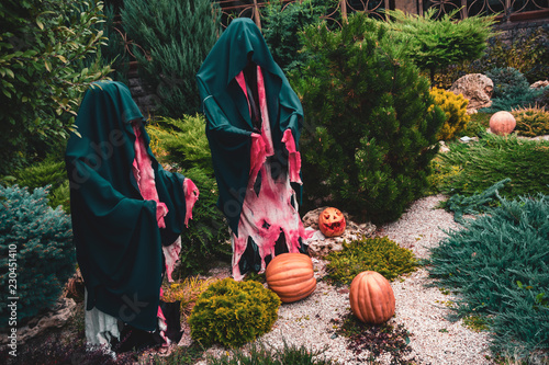 Dummy monks Halloween decoration with the pumpkins photo