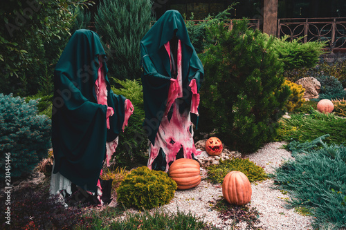 Dummy monks Halloween decoration with the pumpkins photo