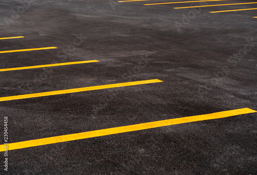 Parking lot for motorcycle and bicycle with yellow line background. asphalt road