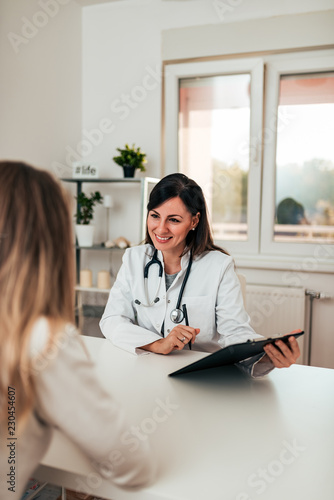 Fotografie Female doctor and female patient talking about test results.