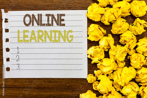 Handwriting text Online Learning. Concept meaning Larning with the assistance of the Internet and a computer. photo