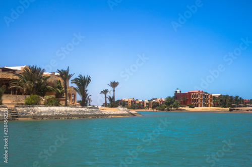 Beautiful view of the coastline with houses and hotels on the red sea. Tourist region in Egypt. Hurghada and its traditions. Stock photo for design