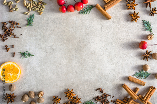 Fototapeta Naklejka Na Ścianę i Meble -  Christmas spices background, baking ingredients arranged in frame of food, copy space