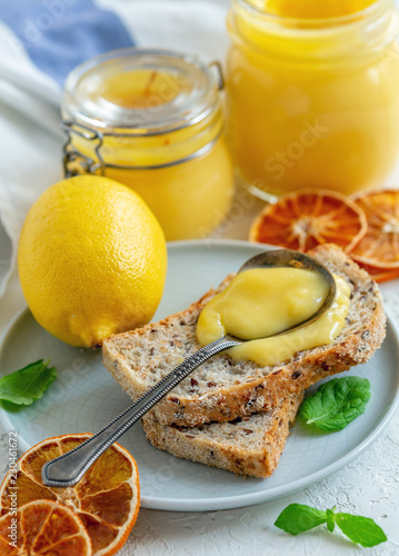 Lemon custard in jars and slices of bread.