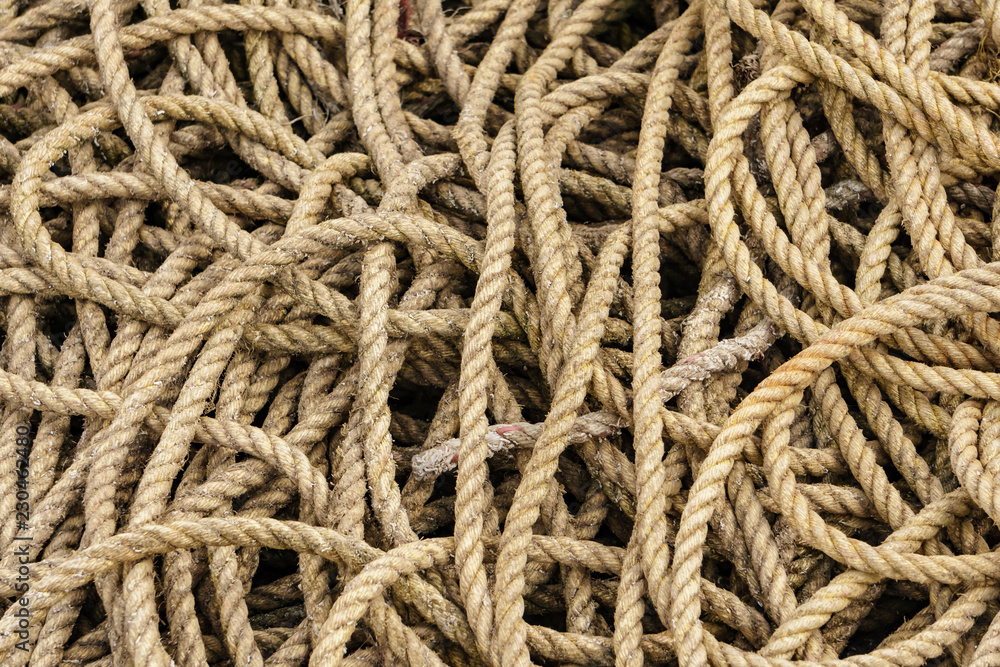 macro of thick brown ropes pattern usable as background or isolated view of ropes