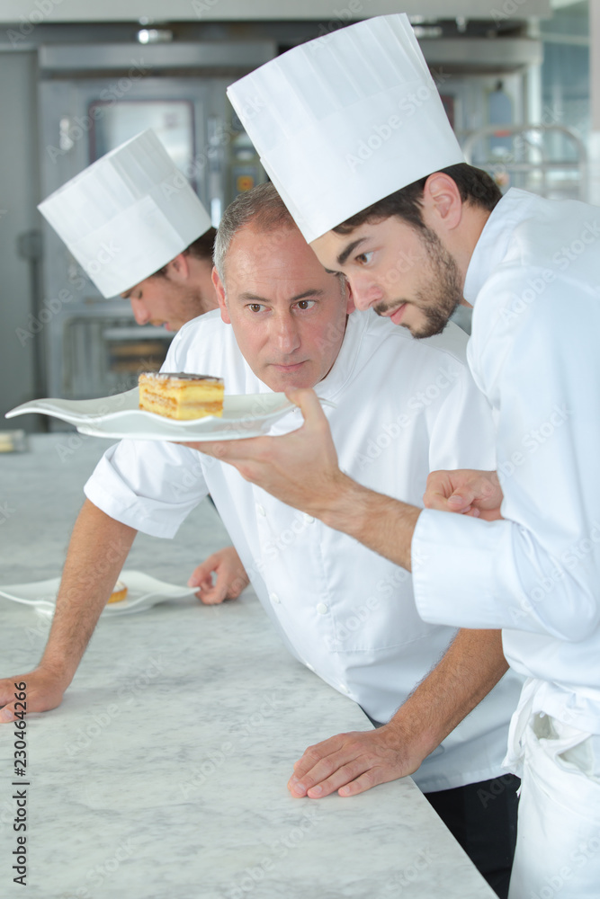 baker instructing apprentice baker instructing apprentice