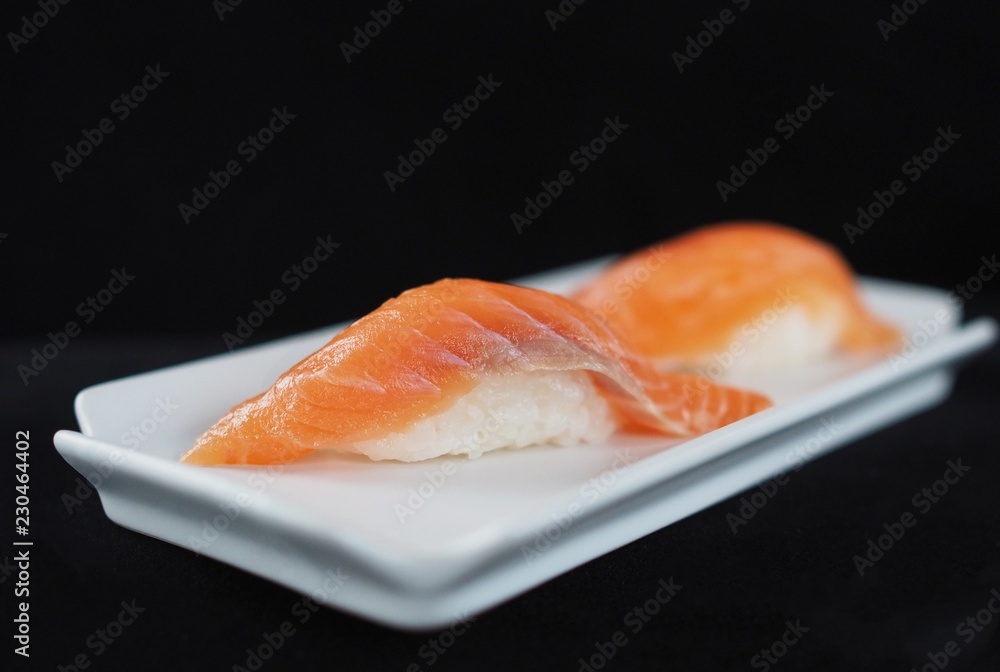 Close up delicious sushi over dark background copy space. Close up delicious sushi over dark background copy space.