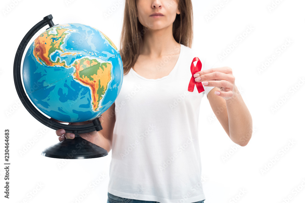 cropped image of woman holding globe and red ribbon isolated on white, world aids day concept cropped image of woman holding globe and red ribbon isolated on white, world aids day concept