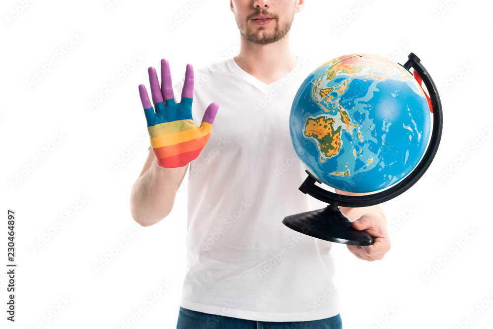cropped image of man holding globe and showing hand painted in rainbow isolated on white, world aids day concept cropped image of man holding globe and showing hand painted in rainbow isolated on white, world aids day concept