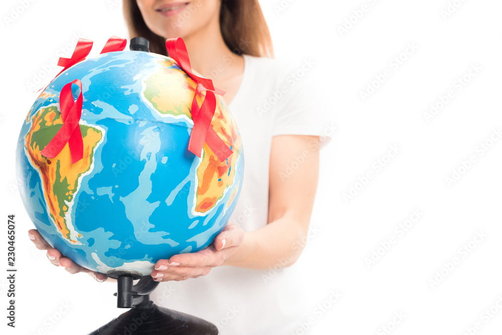 cropped image of woman holding globe with red ribbons isolated on white, world aids day concept cropped image of woman holding globe with red ribbons isolated on white, world aids day concept