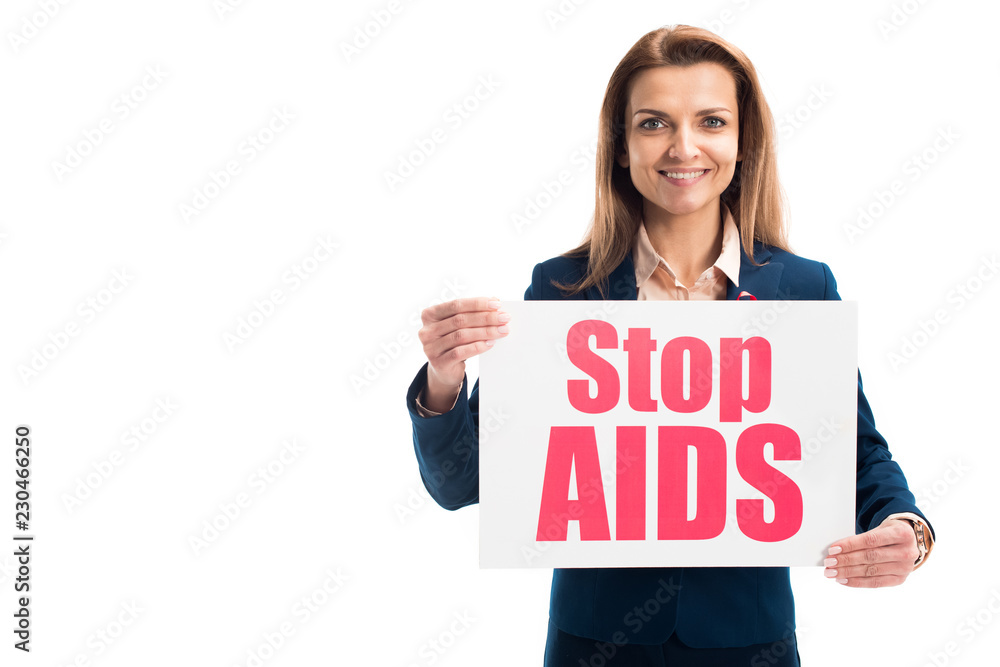smiling attractive businesswoman showing card with stop aids text isolated on white smiling attractive businesswoman showing card with stop aids text isolated on white