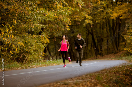 Young people jogging and exercising in nature © BGStock72