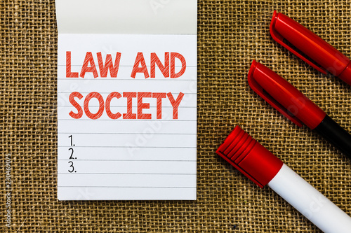 Word writing text Law And Society. Business concept for Address the mutual relationship between law and society. photo