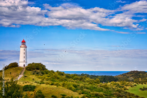 Classic view of the famous lighthouse Dornbusch on the beautiful island Hiddensee with a view of the Baltic Sea, Mecklenburg-Vorpommern, Germany photo