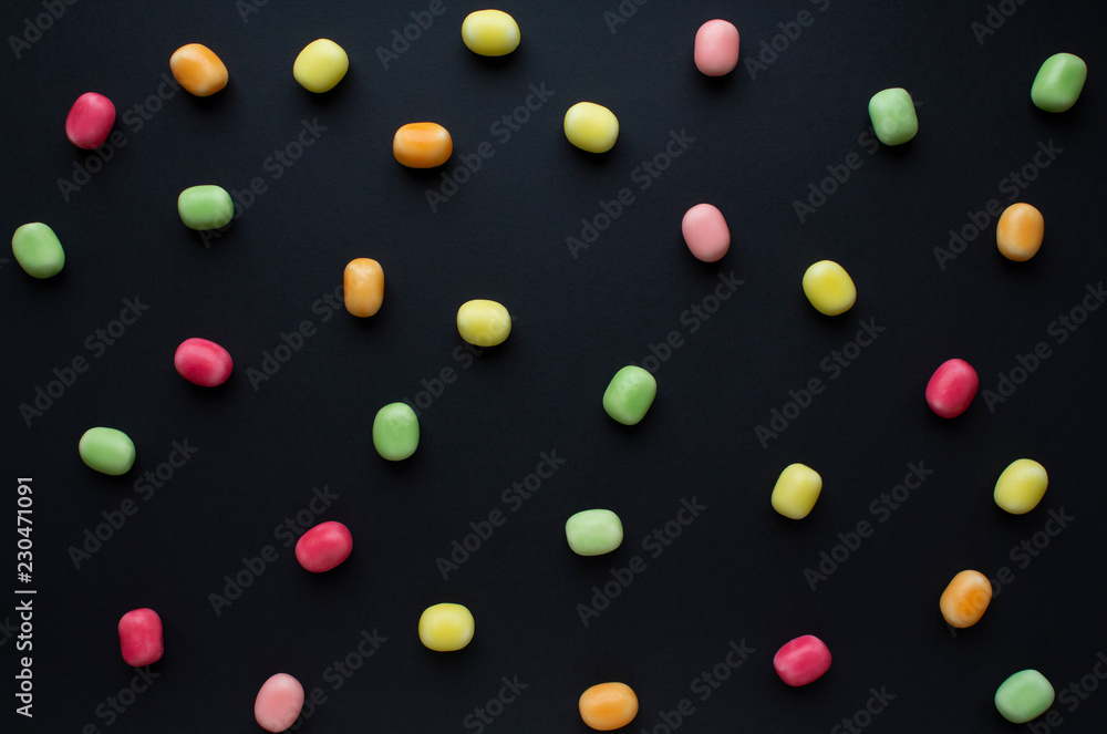 colorful candy on black background colorful candy on black background