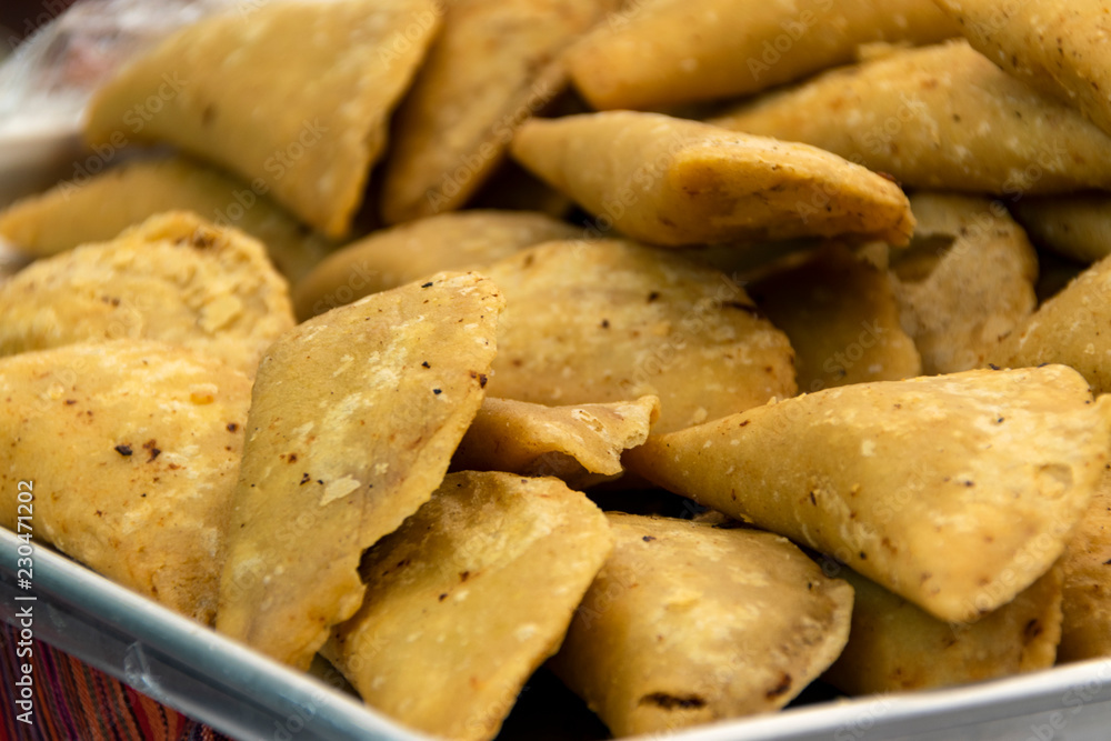 empanda fried corn stuffed with vegetables and meat, food for party and reunion, Latin America. Guatemala.