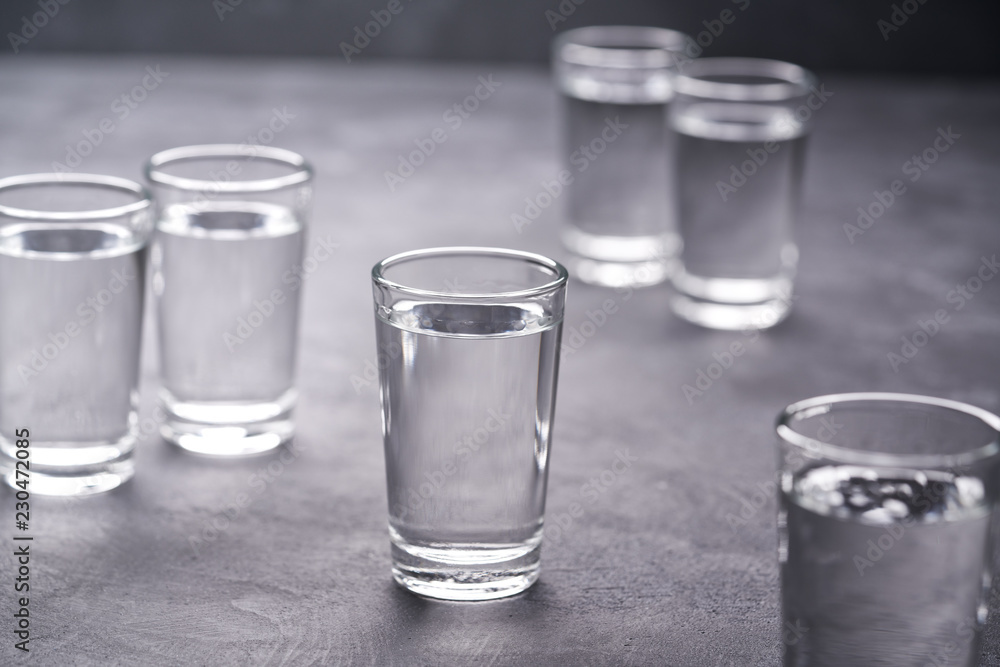 Russian vodka shots on black table, copy space