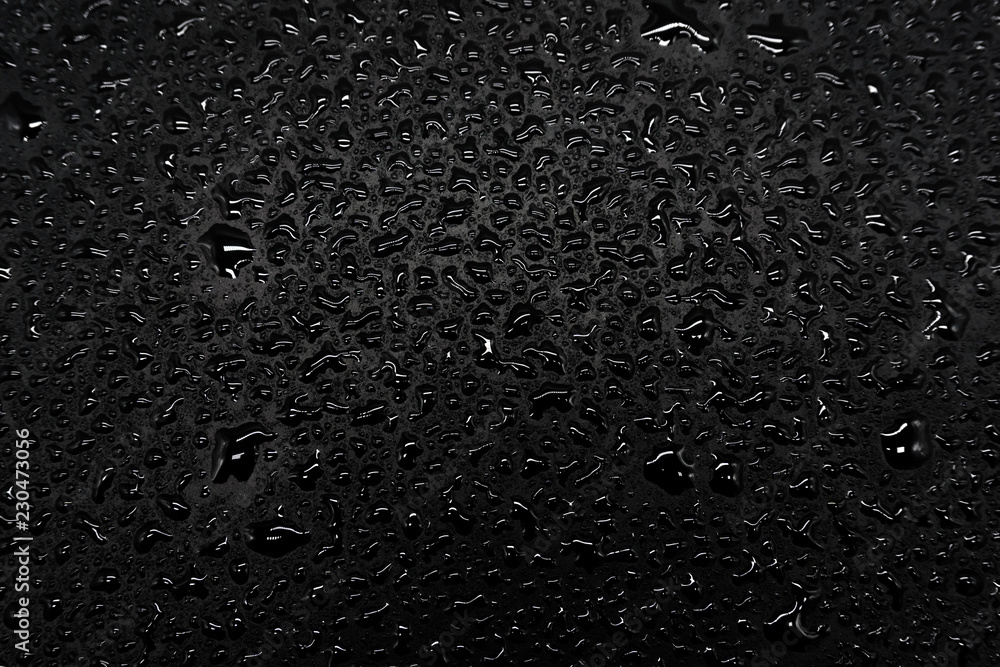 Water drops on a black background, closeup texture Water drops on a black background, closeup texture