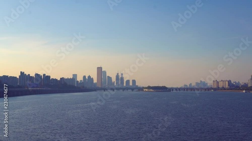 Sunset in Seoul viewed from the Dongjak bridge, here you can see one of the highligts of the city - 63 Tower, which is one of the highest buildings in town photo