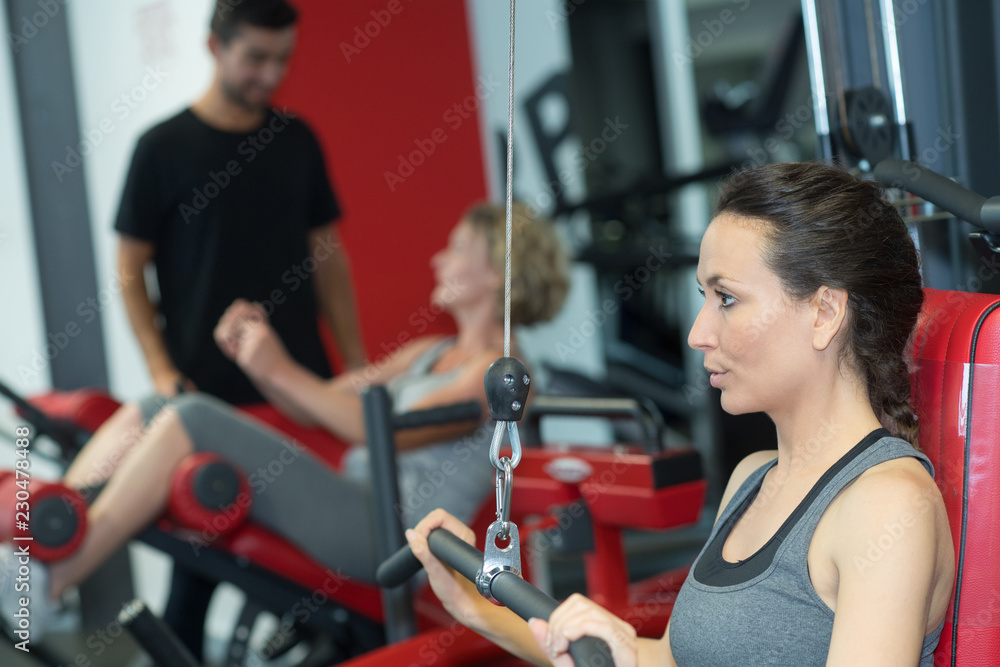 Fototapeta premium woman working out with bar