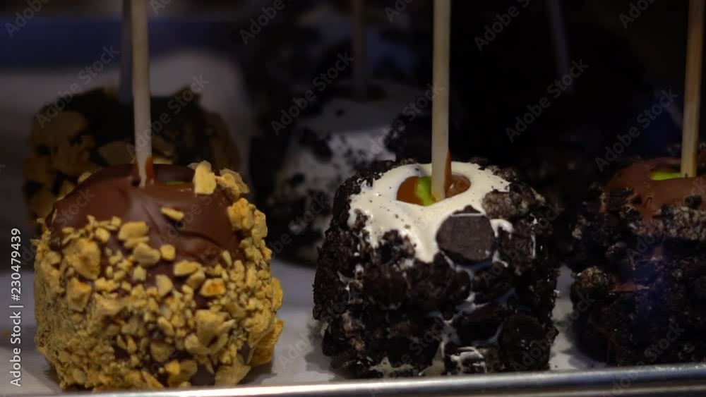 Toffee apples, also known as candy apples in North America, are whole apples covered in a hard toffee, chocolate and/or sugar candy coating with a stick inserted as a handle. Toffee apples, also known as candy apples in North America, are whole apples covered in a hard toffee, chocolate and/or sugar candy coating with a stick inserted as a handle.