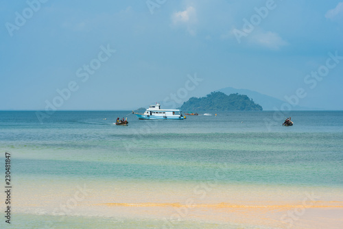 Small ferry is mooring at the west side beach Ao Mae Mai on the island Ko Phayam 