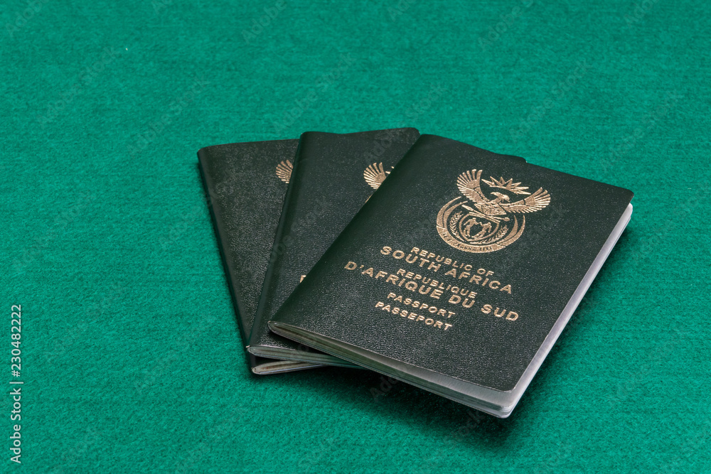 South African passports on green background South African passports on green background