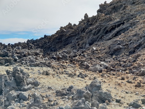Big lava stones at the hiking trail to the big famous volcano Pico del Teide in Tenerife, Europe