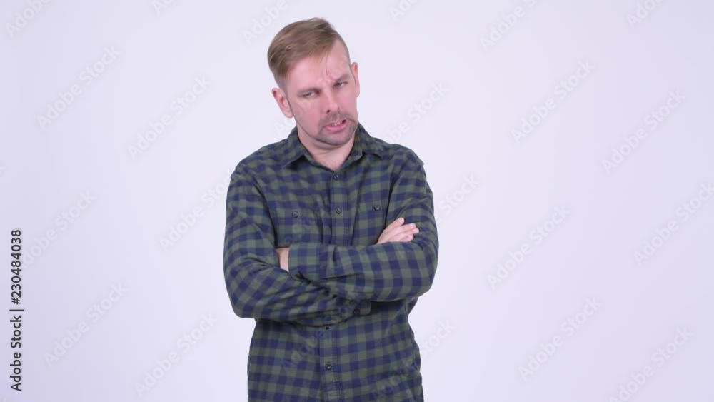 Angry blonde hipster man with arms crossed Angry blonde hipster man with arms crossed