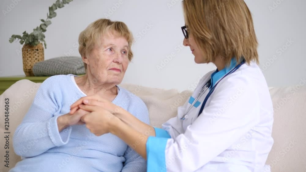 Doctor With Senior Patient. Assistance And Elderly Care Concept. Doctor With Senior Patient. Assistance And Elderly Care Concept.
