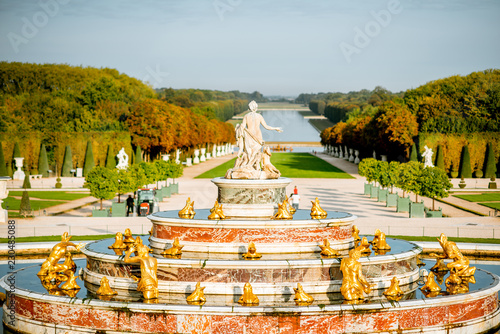Versailles gardens with Latona fountain and Grand canal during the morning light in Versailles, France photo
