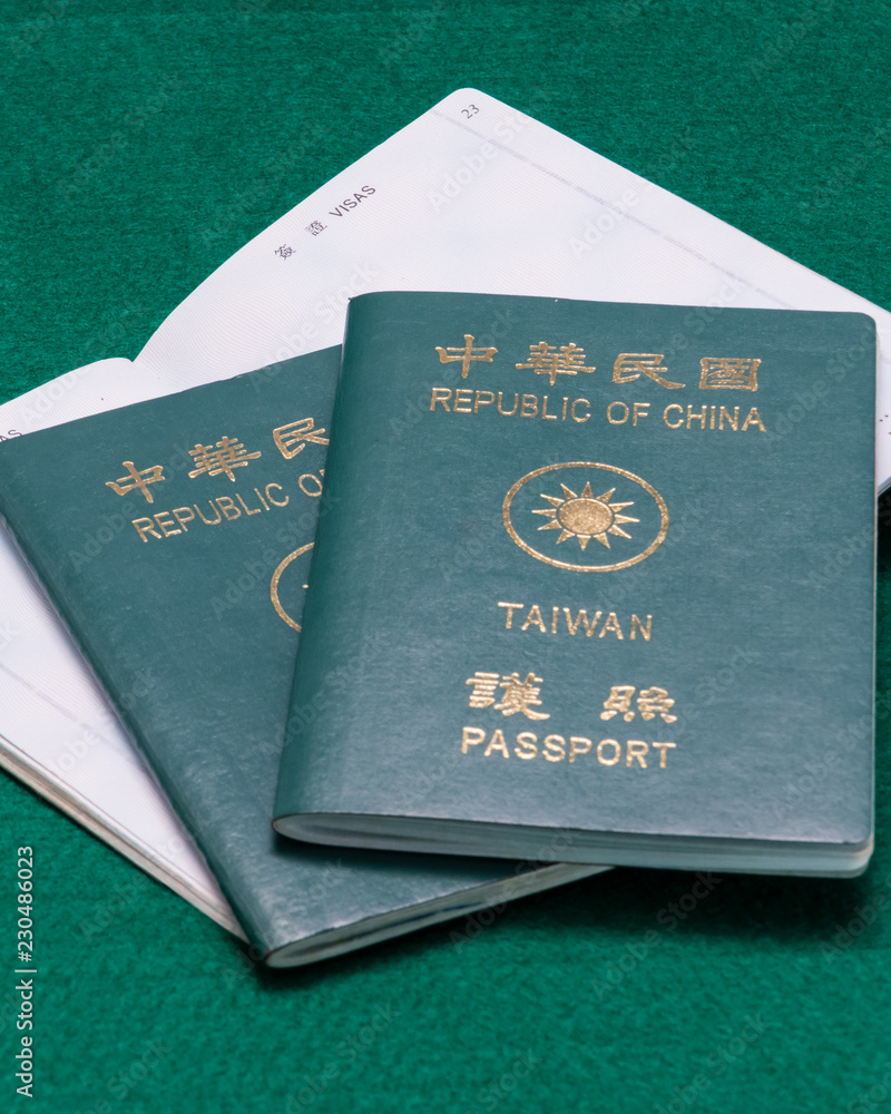 Taiwanese passports on green table Taiwanese passports on green table