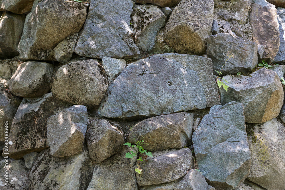 Texture. Fragment of an ancient wall of stone masonry.