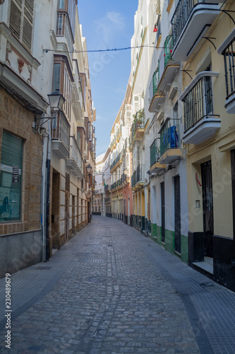 A medieval street  empty of crowds  in the city of Cadiz  Spain.